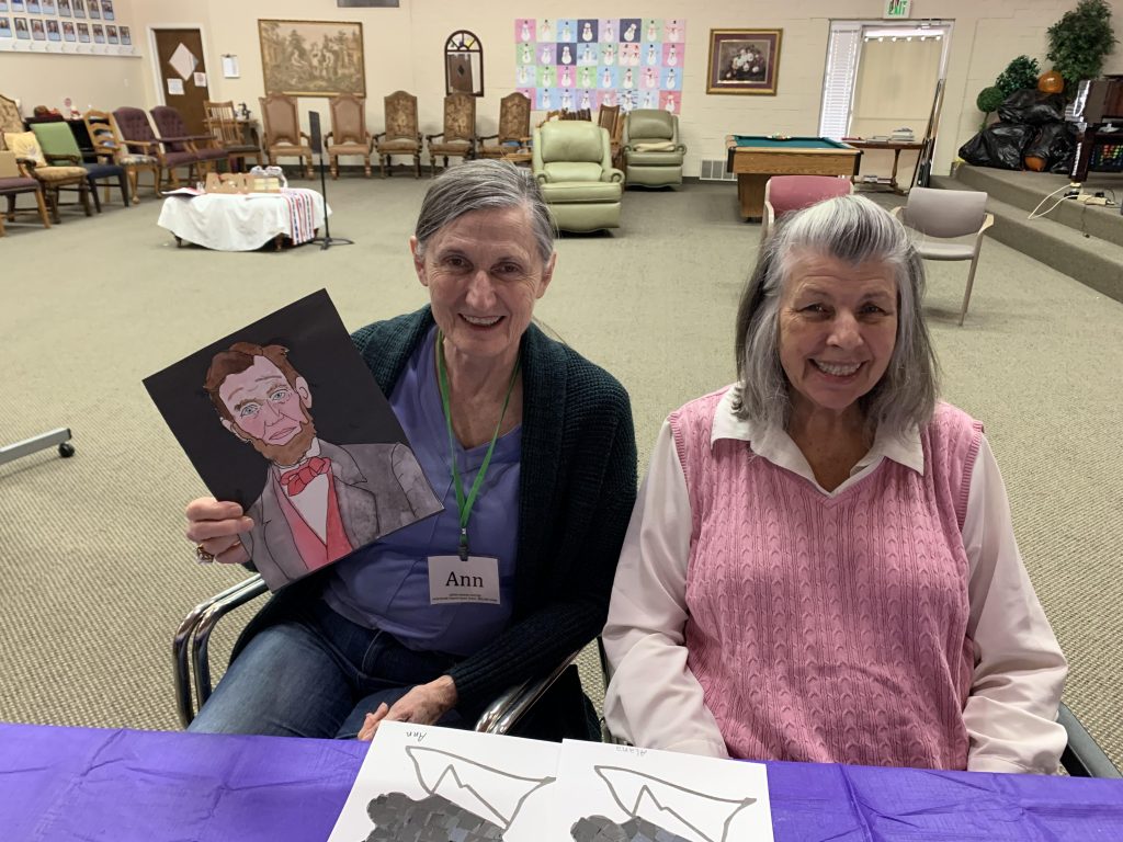 Two elderly women enjoying art at Aspen Senior Day Center